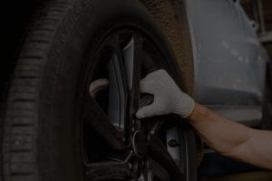 worker replacing tire